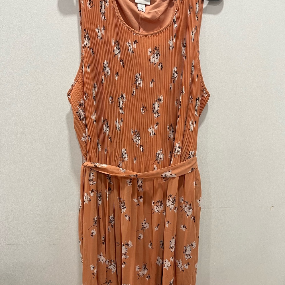 Coral floral dress with pleated skirt and sash. Worn once. Perfect for summer!